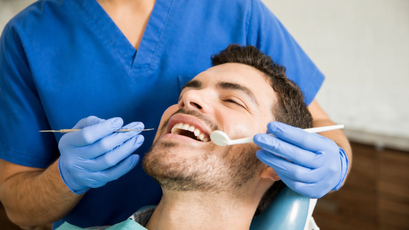 Scaling and polishing treatment to remove stains from front teeth during dental cleaningScaling and polishing treatment to remove stains from front teeth during dental cleaning
