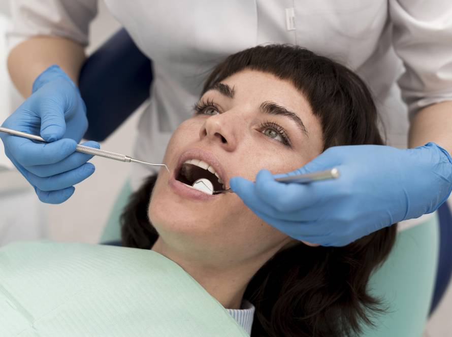 Dentist examining a damaged tooth during dental evaluation for root canal treatment and infection assessment