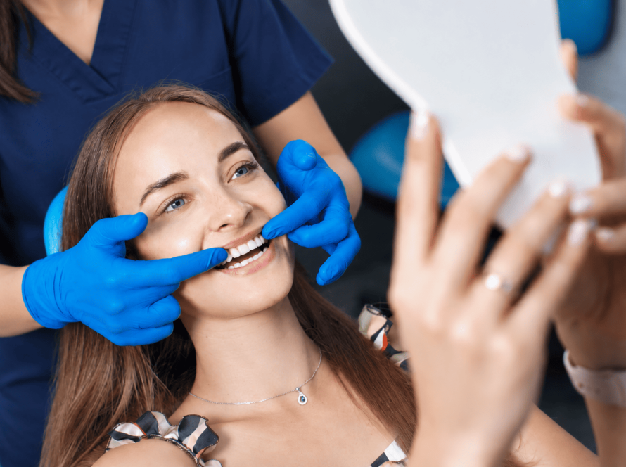 Dentist examining a patient's teeth during a cosmetic dental consultation